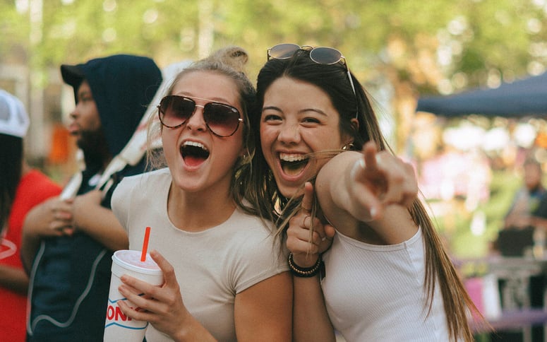 Two women striking a friendly pose