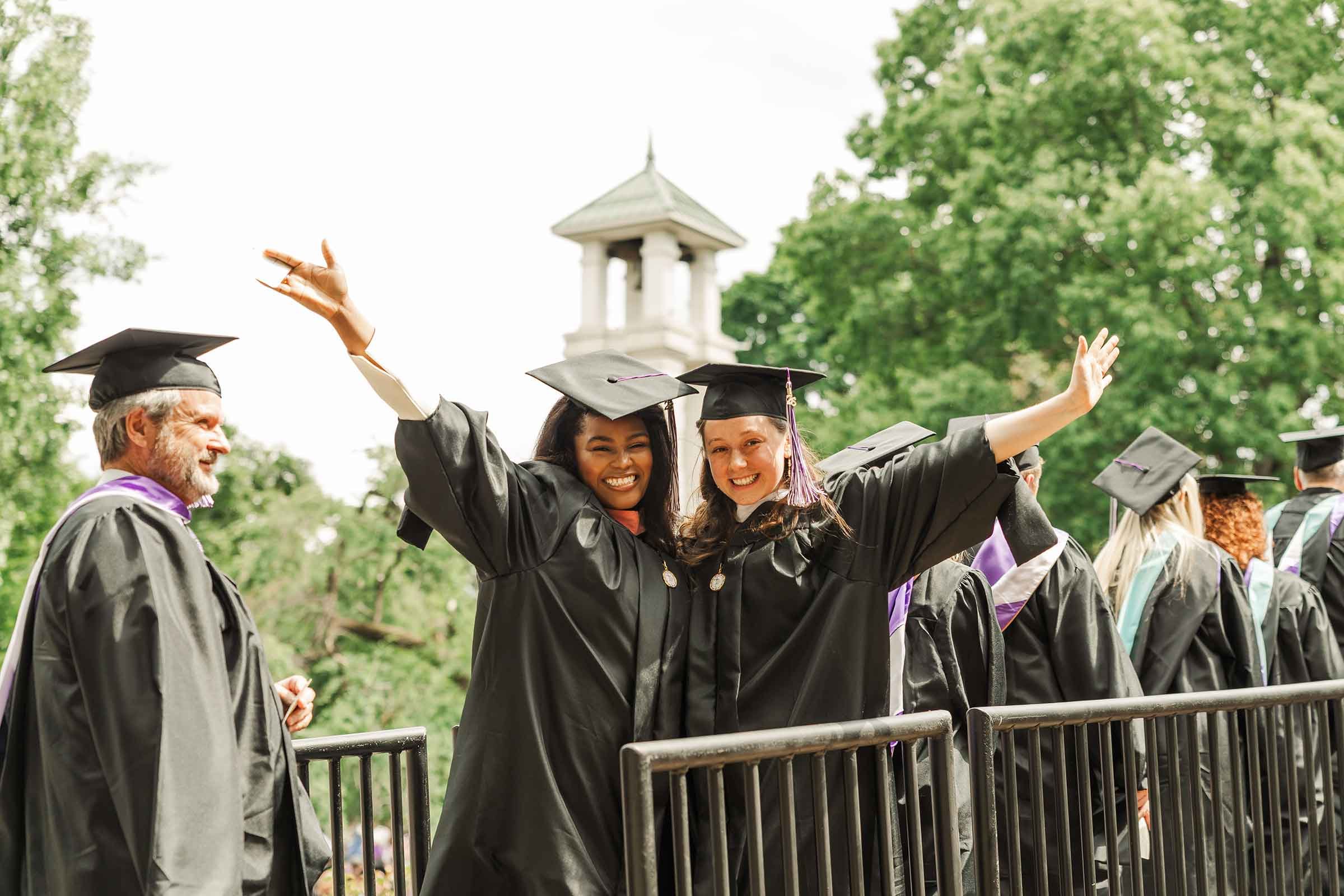 Two Trevecca graduate pose for a photo at Commencement.