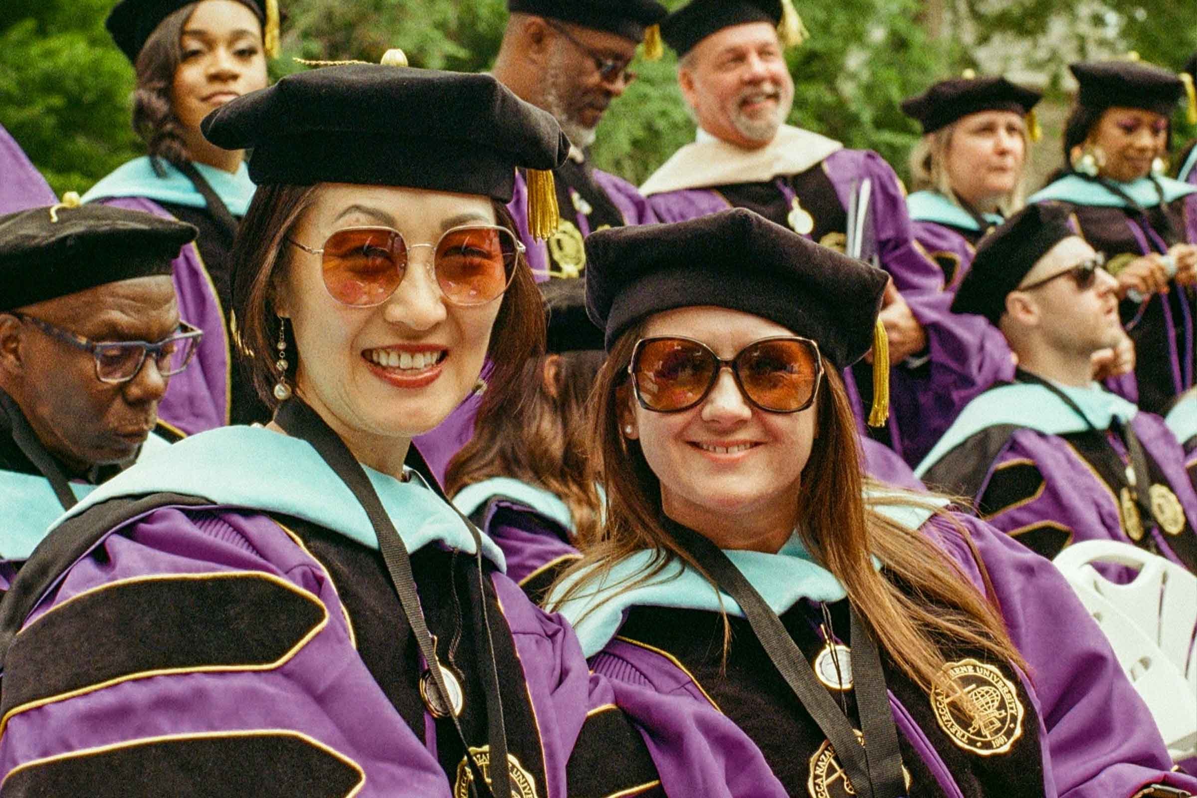 Trevecca graduates smile for a photo at Commencement.