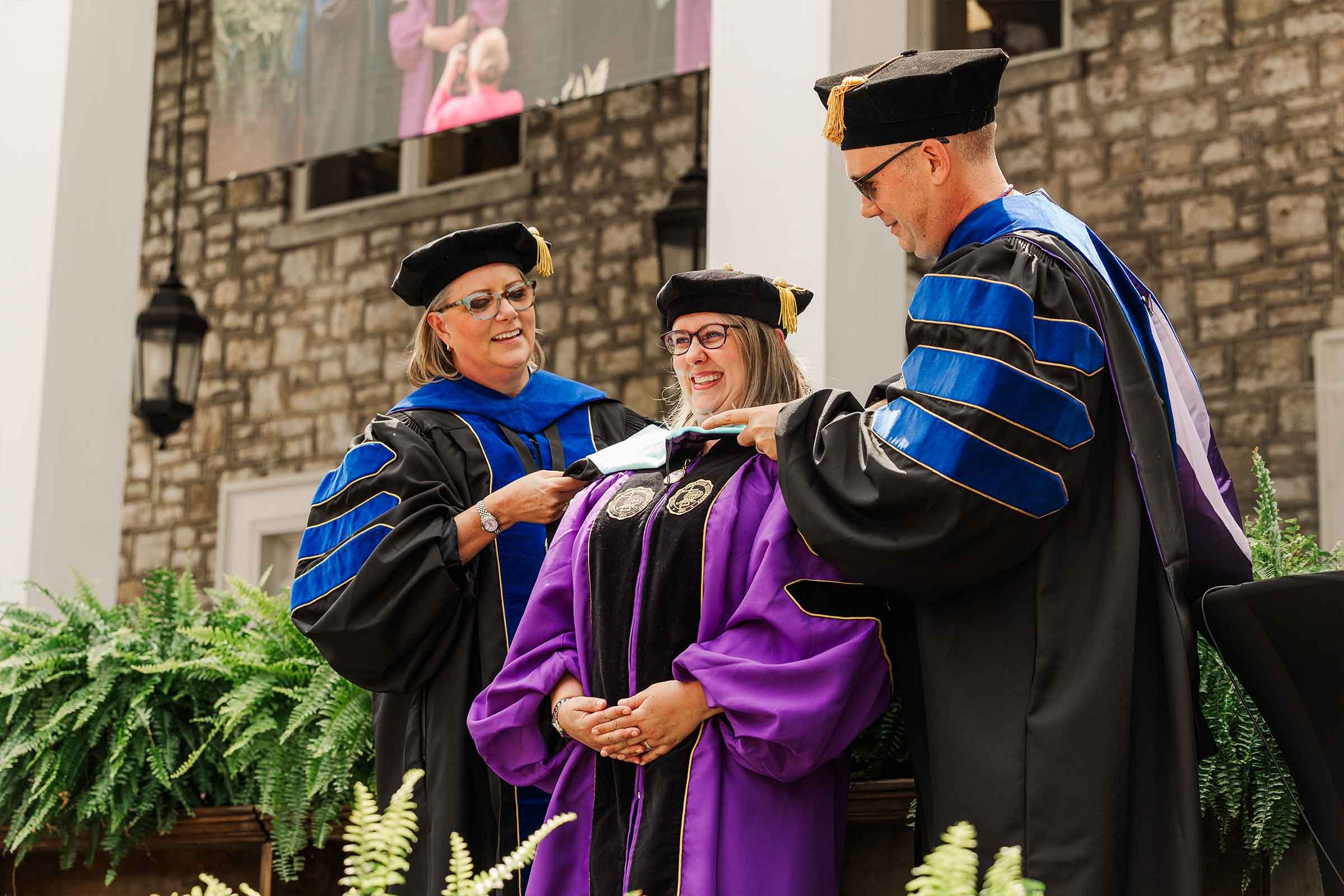 Trevecca graduate Mollie Yoder is hooded at Commencement.